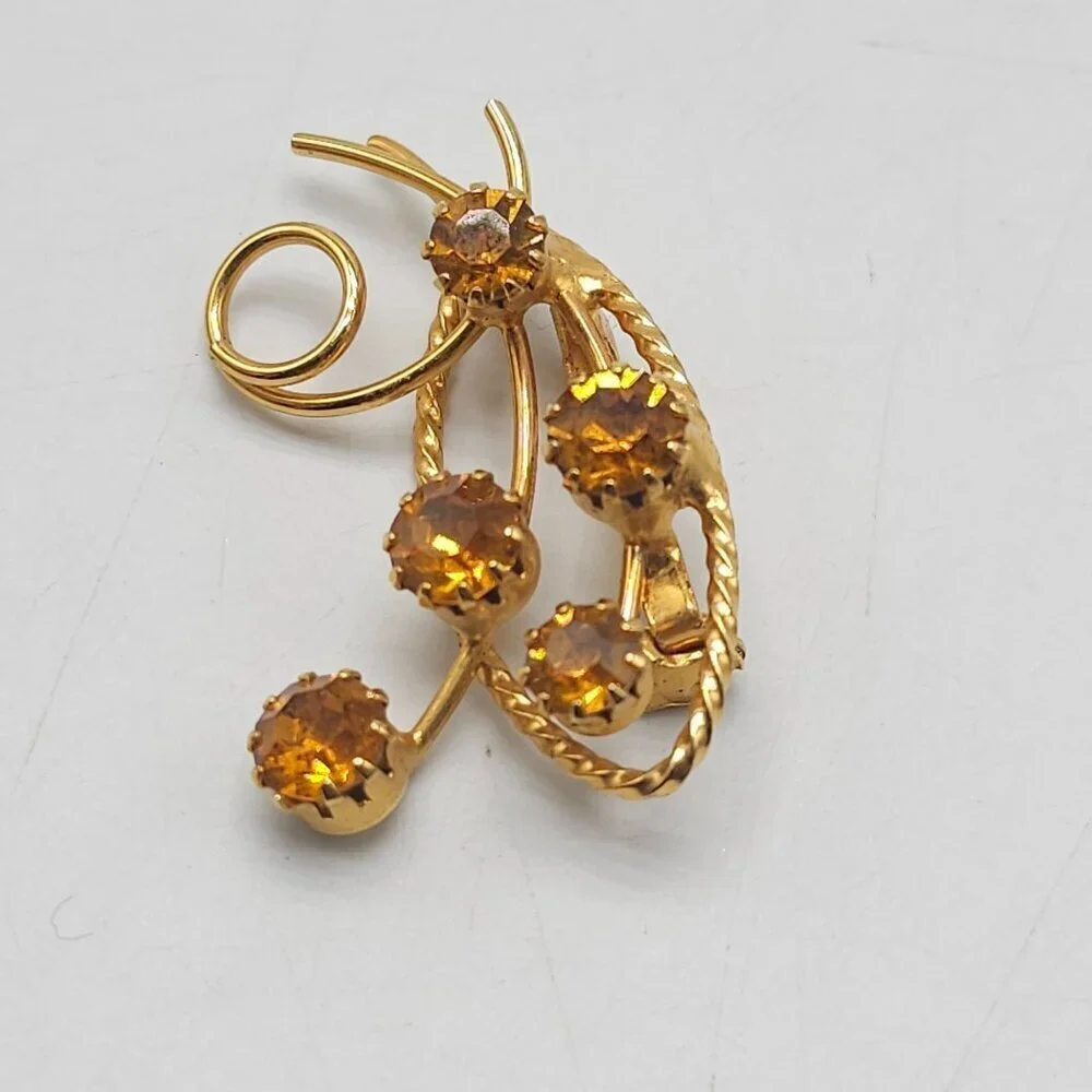 Vintage Gold Tone Floral Brooch With Amber Colored Rhinestones